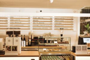 Commercial espresso grinder setup in a coffee shop showing professional coffee equipment for café owners
