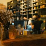 Commercial espresso machine features including boiler capacity, steam power, durability, and workflow design for café owners