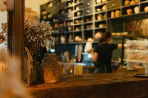 Commercial espresso machine features including boiler capacity, steam power, durability, and workflow design for café owners