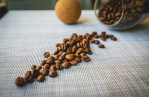coffee beans being weighed on a digital scale for daily cafe coffee consumption planning