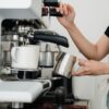 commercial espresso machine on a cafe counter illustrating electricity consumption and operating costs