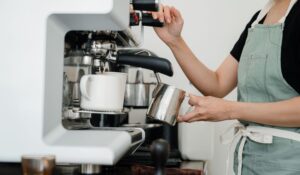 commercial espresso machine on a cafe counter illustrating electricity consumption and operating costs
