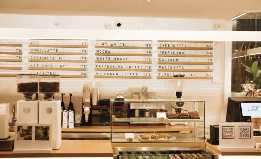 Commercial espresso grinder setup in a coffee shop showing professional coffee equipment for café owners