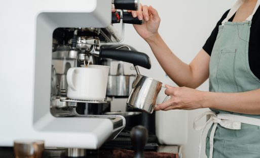 commercial espresso machine on a cafe counter illustrating electricity consumption and operating costs